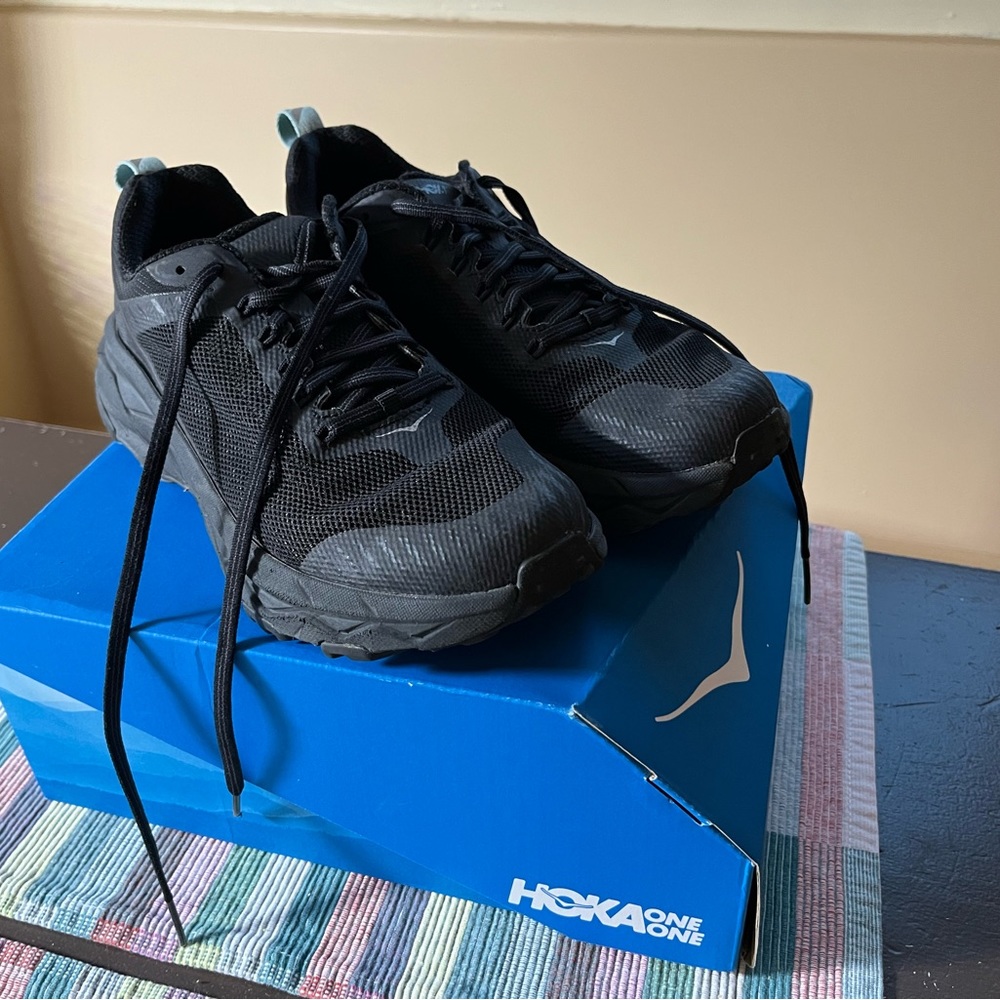 Hoka solid black women’s size 7.5 running shoes in excellent condition with box.